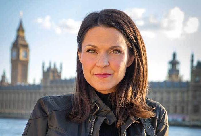 Maggie Rulli photographed in front of the Parliment buildings in London.